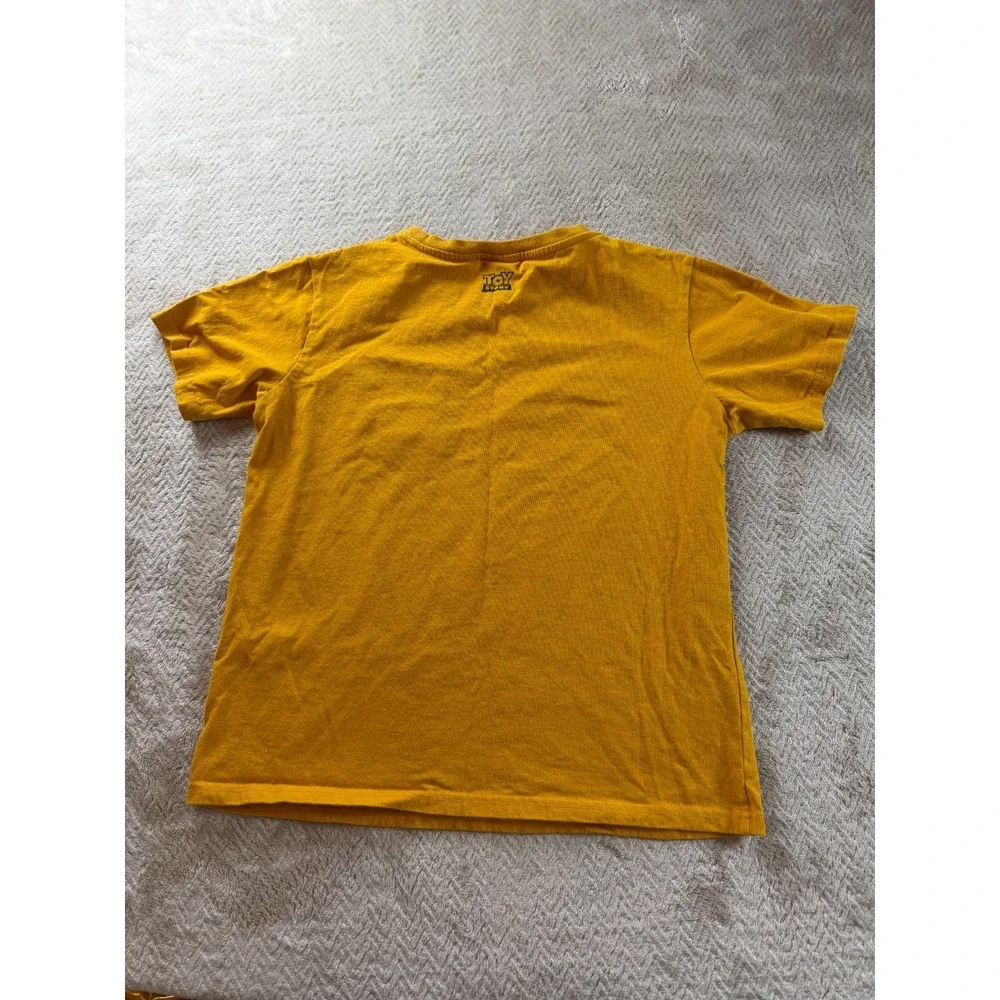 Disney Pixar CacoToy Story T-Shirt Kids S Mustard Yellow Cotton Chest Pocket Tee